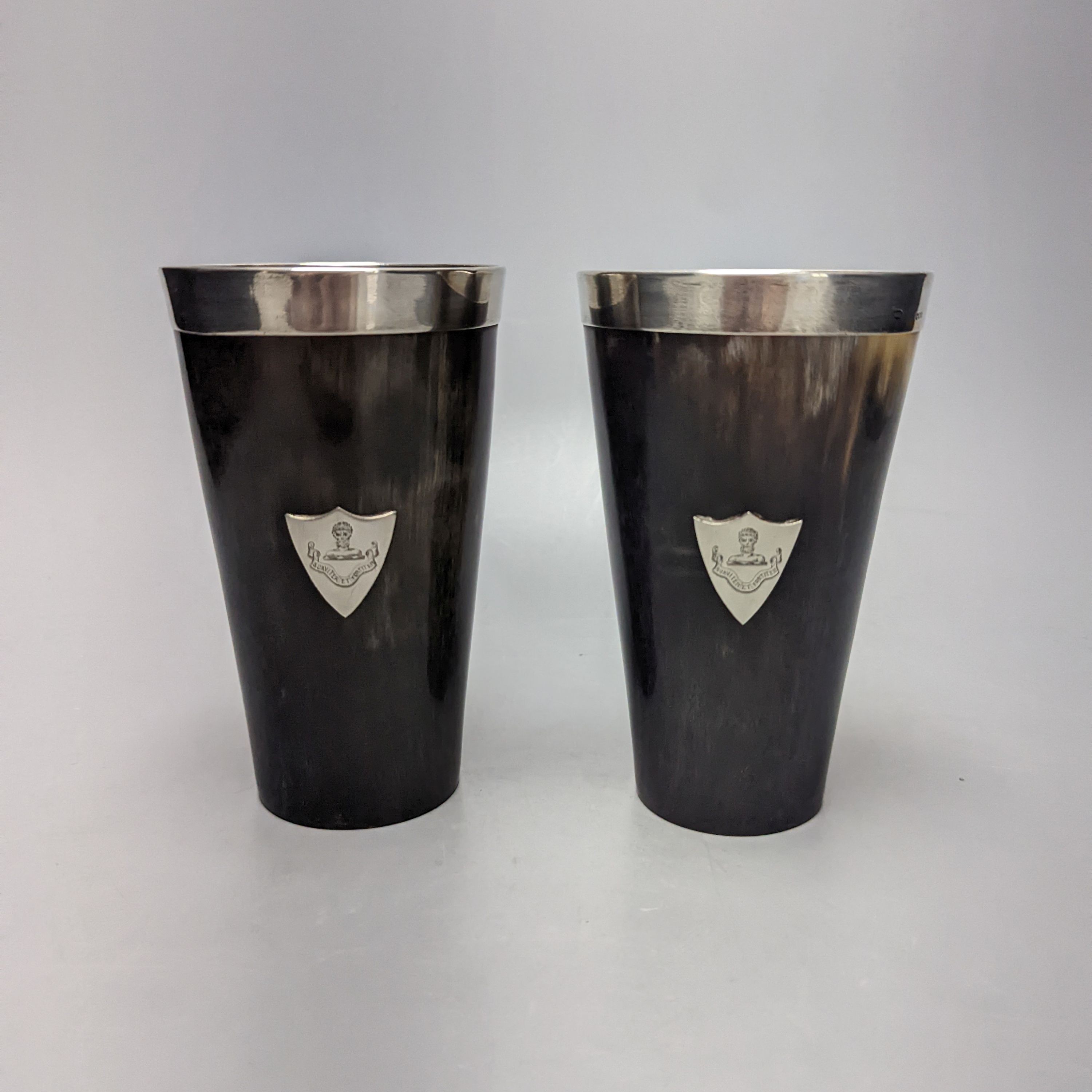 A pair of late Victorian silver mounted horn beakers, with crested shield appliques, John Newton Mappin, London, 1882, 14.1cm.